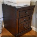 F34. Ashley Furniture wooden file cabinet. 23"h x 18"w x 22"d 
